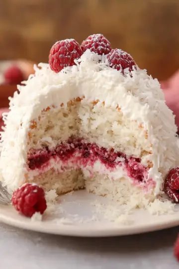 Raspberry Surprise Coconut Snowball Cake
